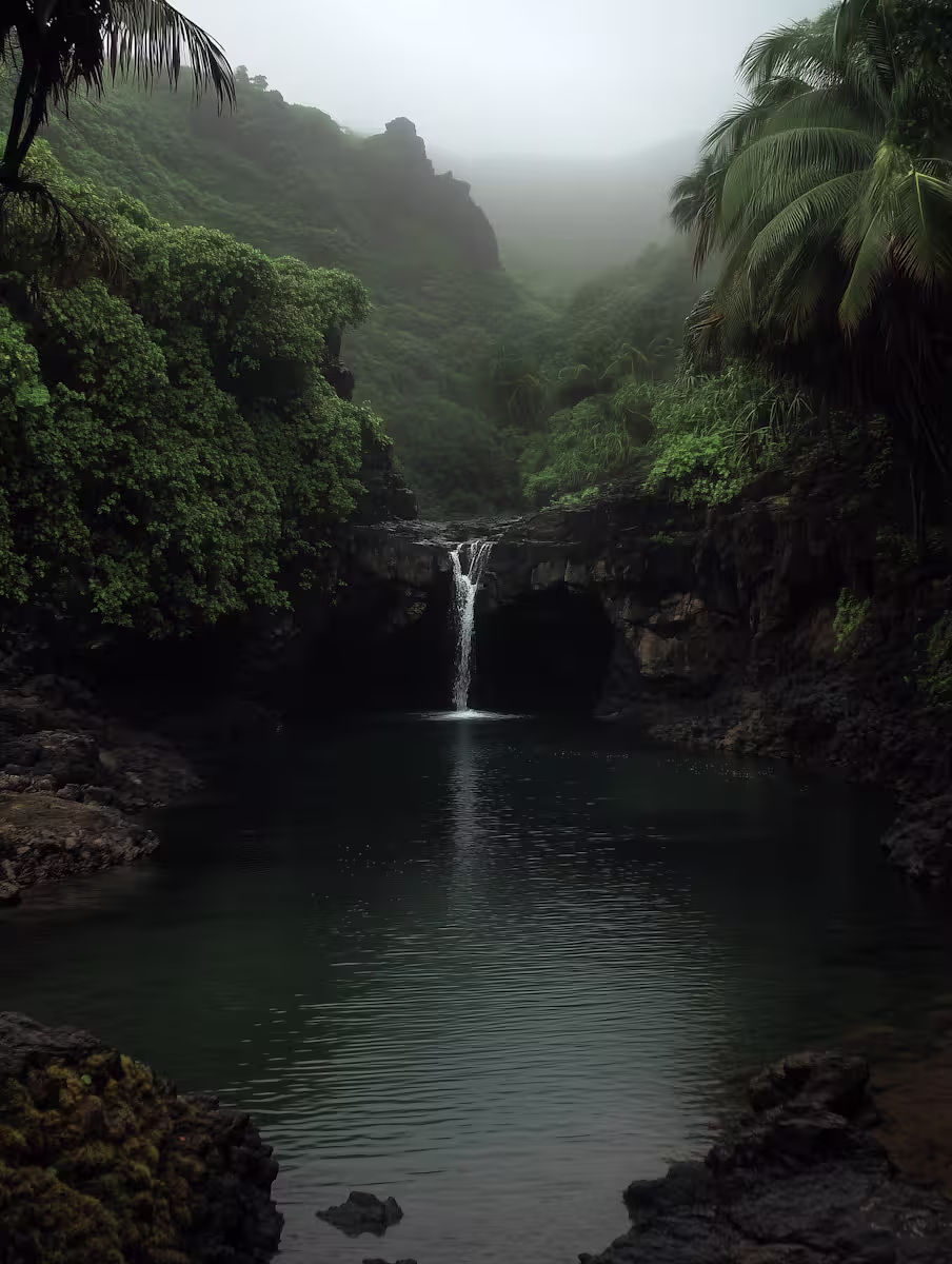 Tranquil waterfall surrounded by lush greenery hills